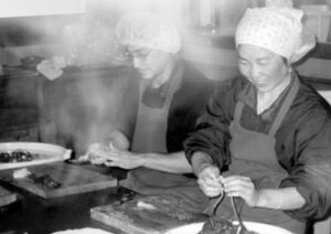 Workers processing leeks